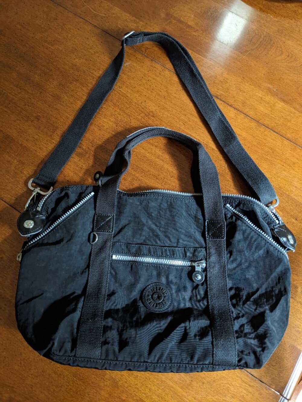 Tote bag both handheld and crossbody by Kipling, water resistant, black